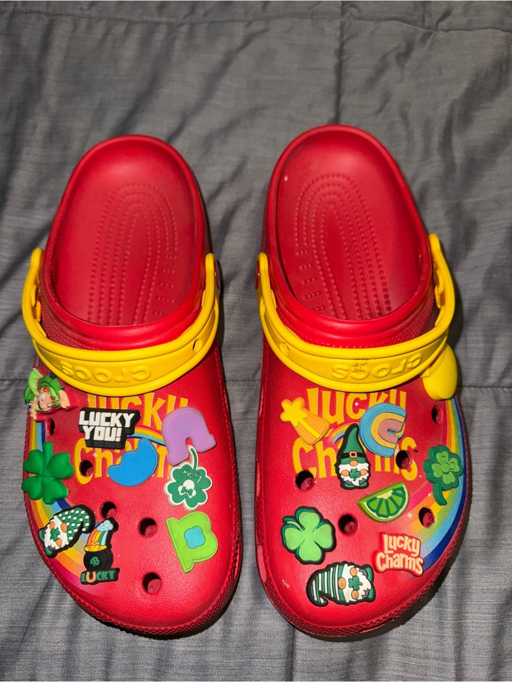 CROCS Red Clog Sandals with Yellow Heel Straps and Lucky Charms Jibbitz